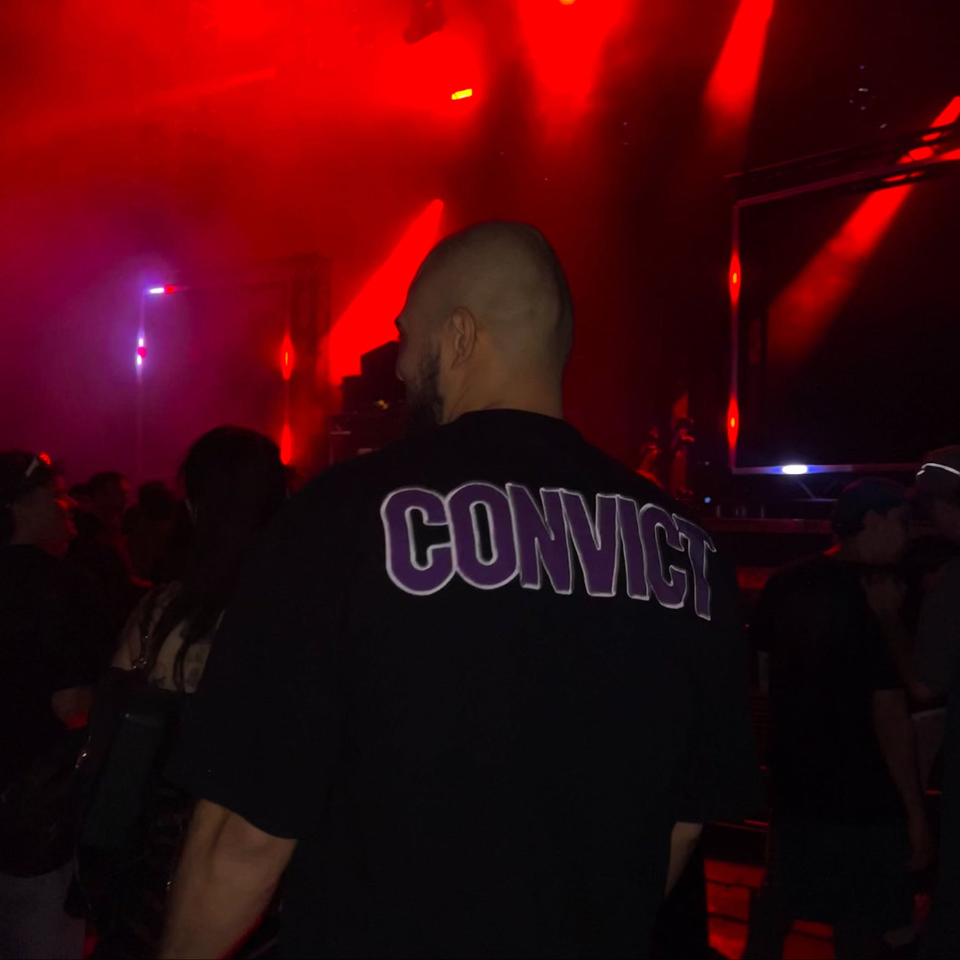 CONVICT Purple Logo Tee — back view with CONVICT embroidered across the back in signature purple